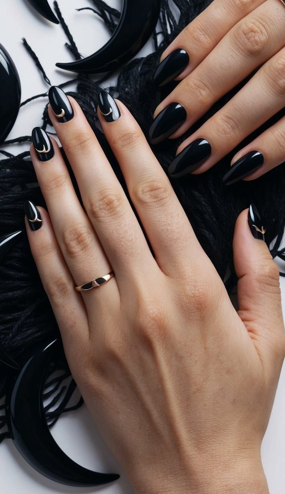 Shiny black nails with minimalist gold crescent moon accents—perfect for a sleek and mystical emo vibe.