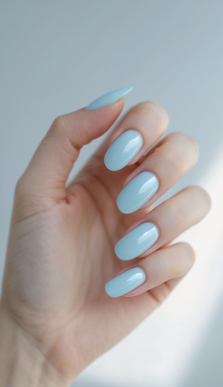 Squoval nails painted in a smooth sky-blue gloss, offering a clean and serene plain nail art concept.
