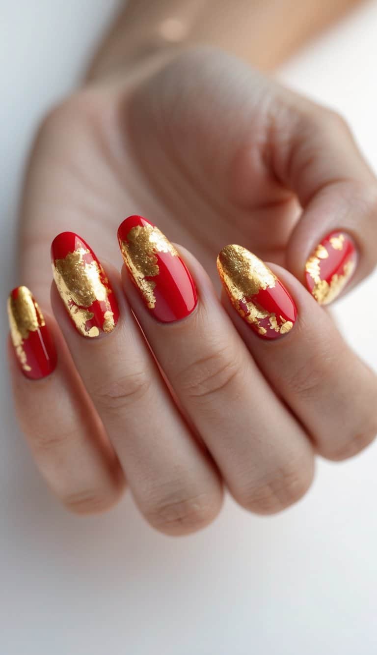 An angled photograph captures red almond nails decorated with uneven gold foil accents, evoking a radiant lunar new year nail art idea inspired by traditional colors.