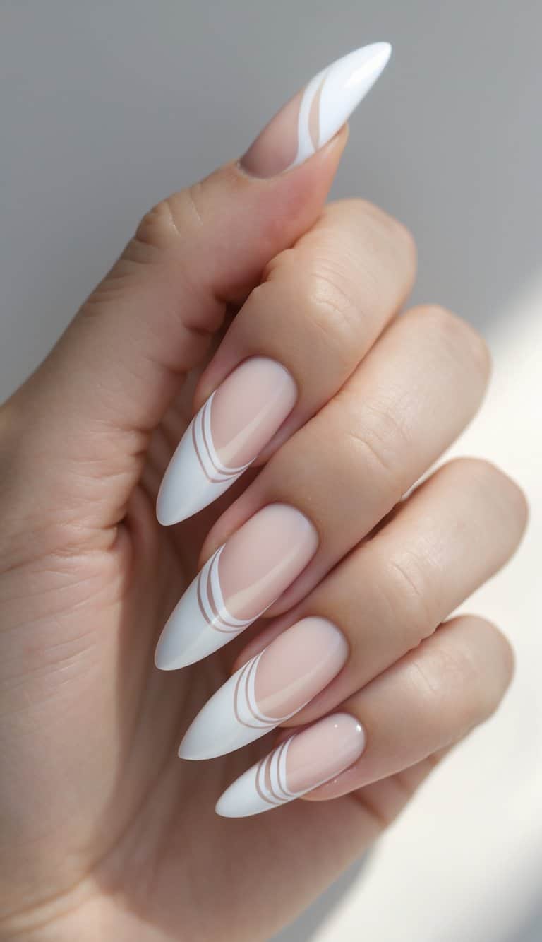 Close-up of a hand showing long pointed nails with soft nude polish and layered white arc designs at the tips in a graceful DIY style.
