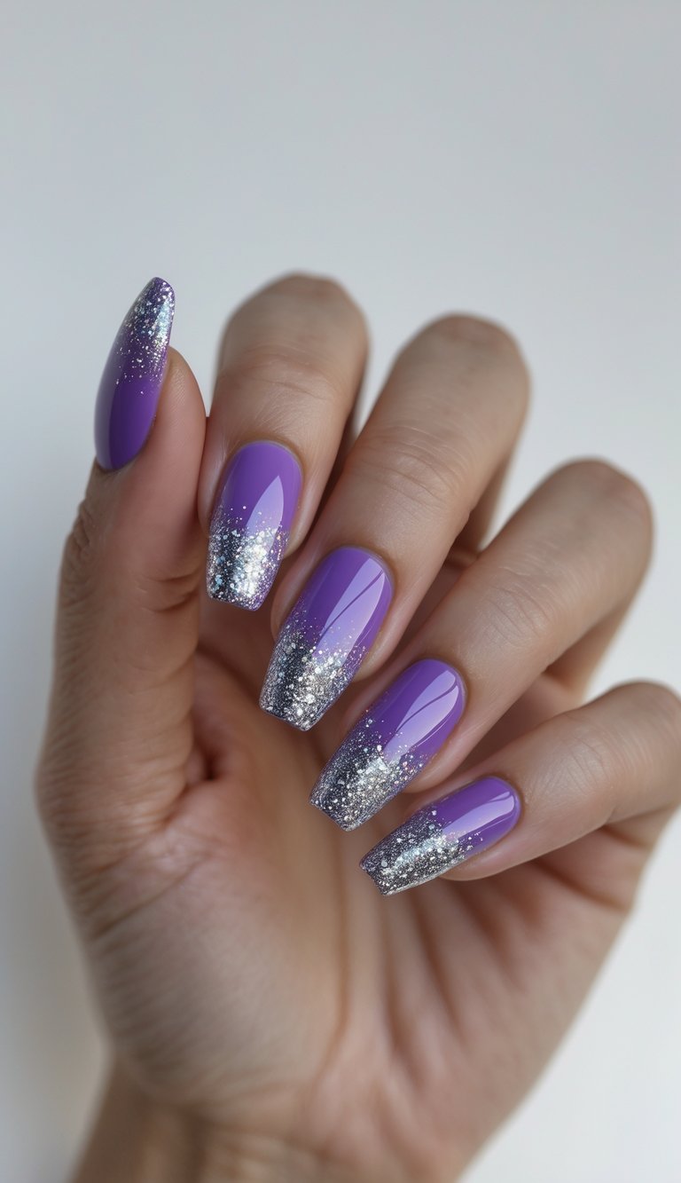 Purple nails with silver glitter French tips forming a soft ombré effect, glossy surface, smooth blending, and a glamorous colored French nail art idea design.