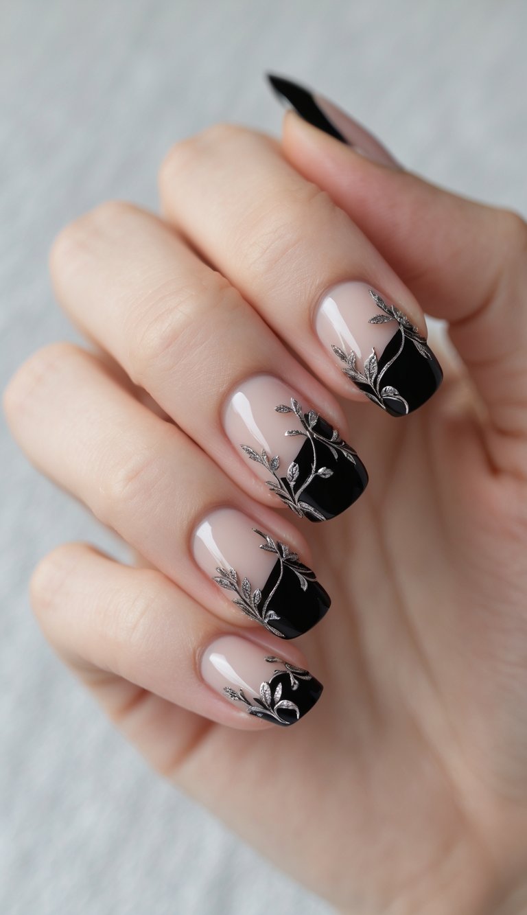 Close-up of a hand showing nails with black French tips and delicate vine patterns on a white background.