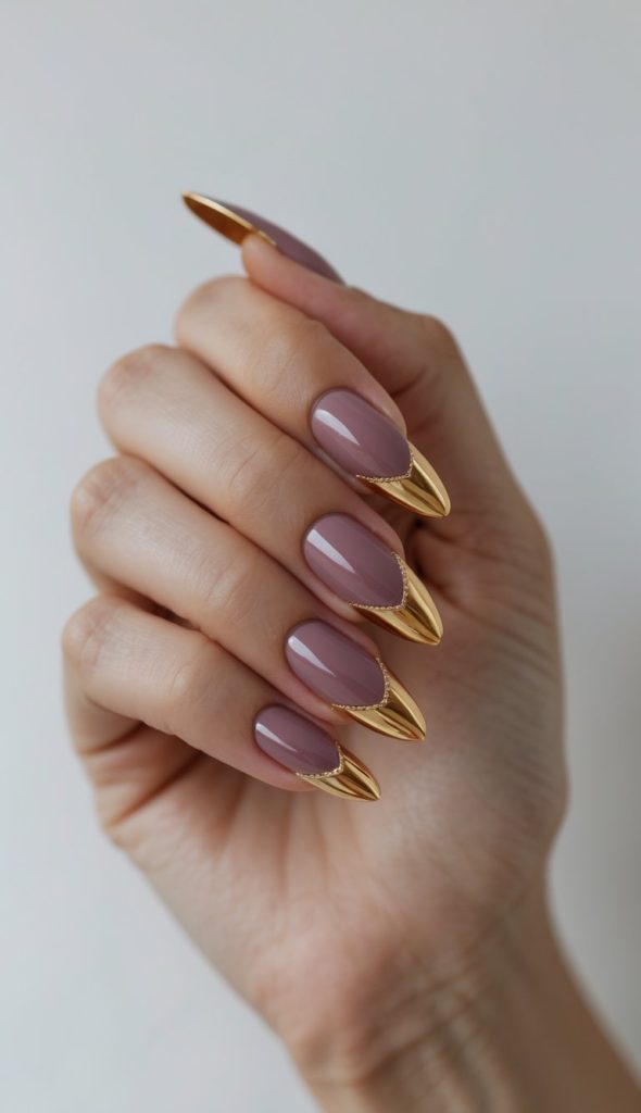 Mauve-colored nails accented with metallic gold pointed French tips, glossy finish, clean edges, and a sophisticated colored French nail art idea design.