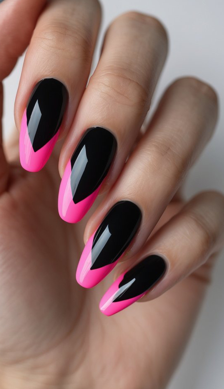 Bold black nails and electrifying hot pink V-shaped tips, creating a high-contrast, modern twist