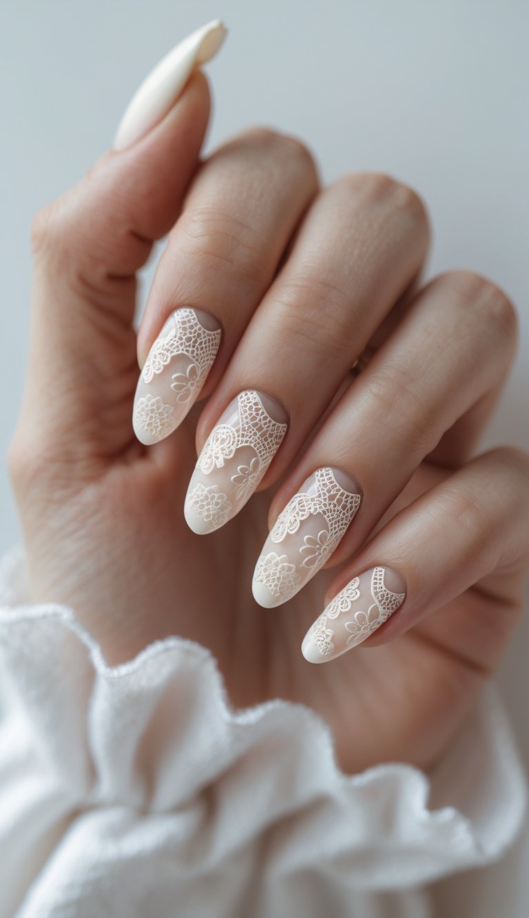 Close-up of one hand with cream-colored nails featuring detailed lace patterns on a white background.