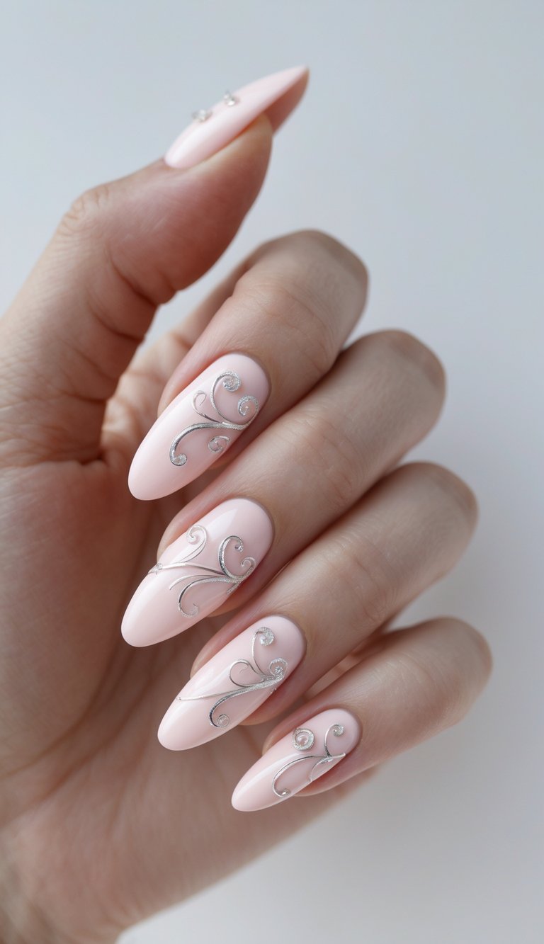 Seen from an angled perspective, a hand shows long almond nails designed as a pink and silver nail art idea, featuring glossy pink polish with elegant silver scroll detailing.
