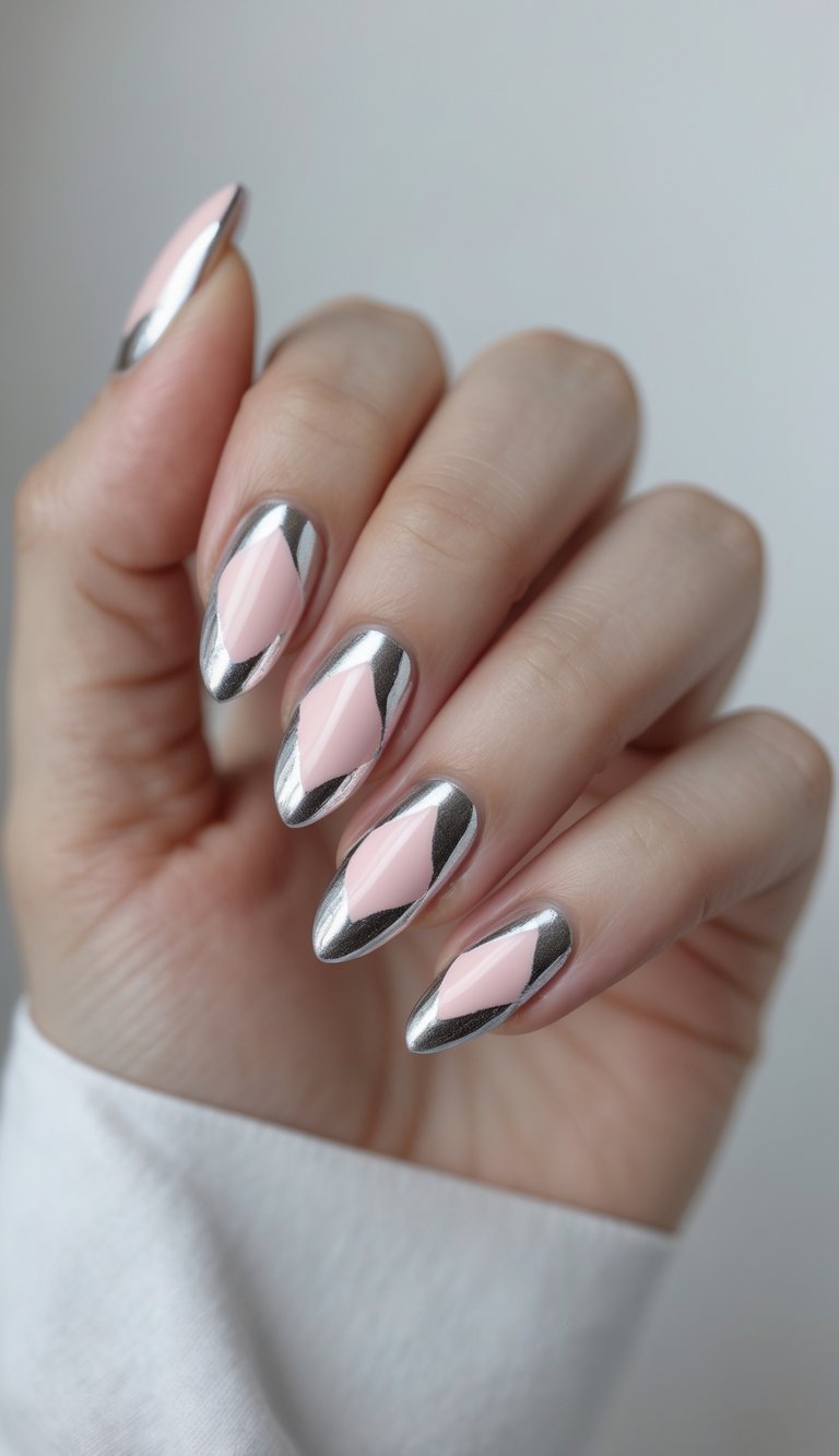 Seen from a natural angle, a hand shows long almond nails designed in a pink and silver nail art idea, featuring glossy pink interiors and precise silver chrome edging.