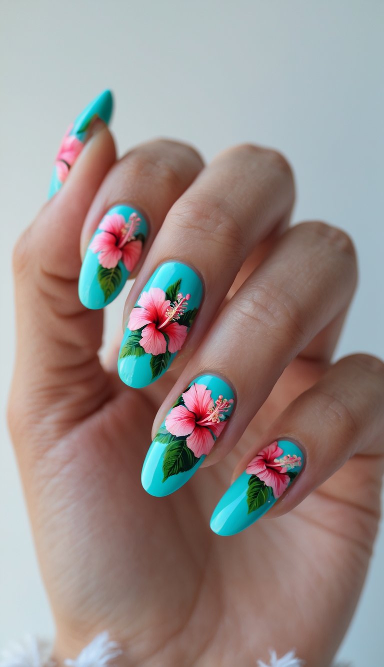 Bright turquoise nails on a raised hand, each nail decorated with a floral nail art idea of vivid hibiscus petals and finely detailed leafy accents.
