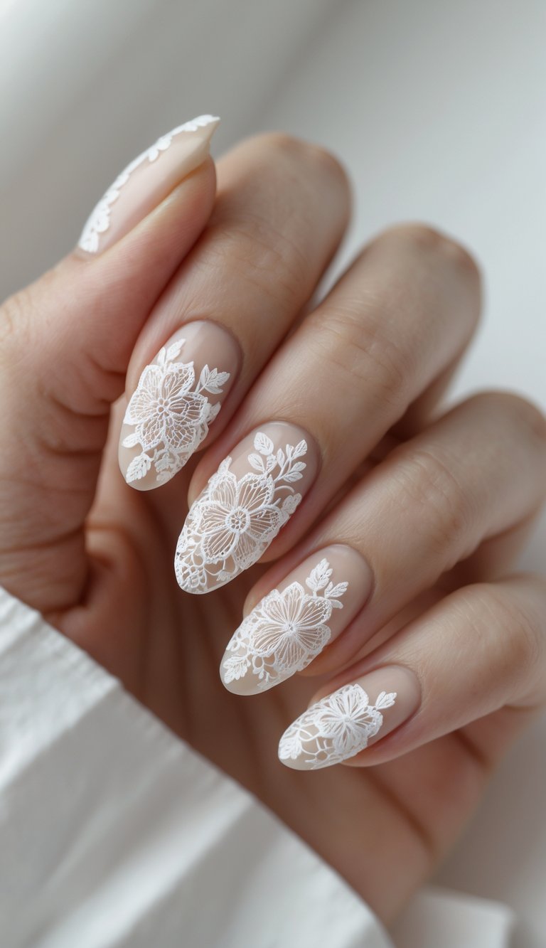 Hand showing bridal-style floral nail art idea with white floral lace patterns on sheer natural nails, creating a soft and elegant effect.