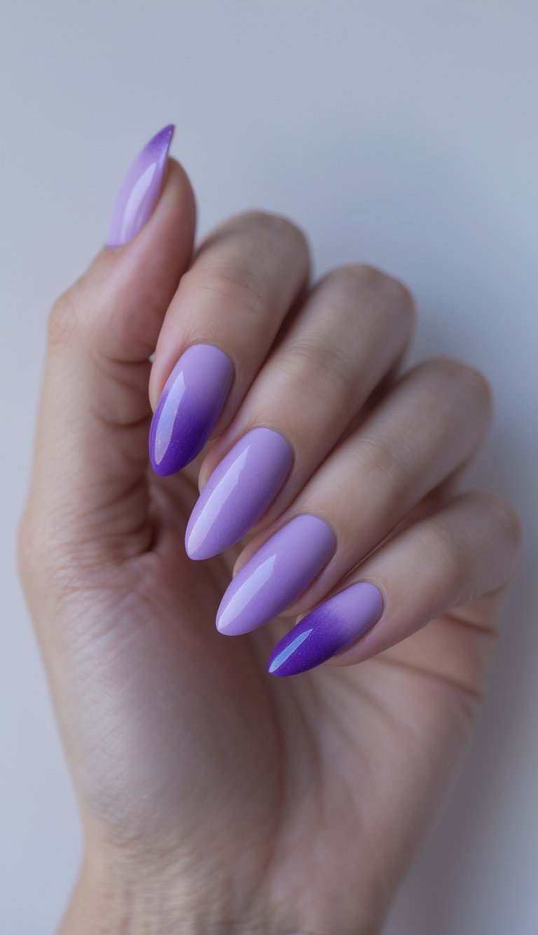Skittle nail art idea with a glossy ombré fade from light orchid purple to deep violet across almond-shaped nails