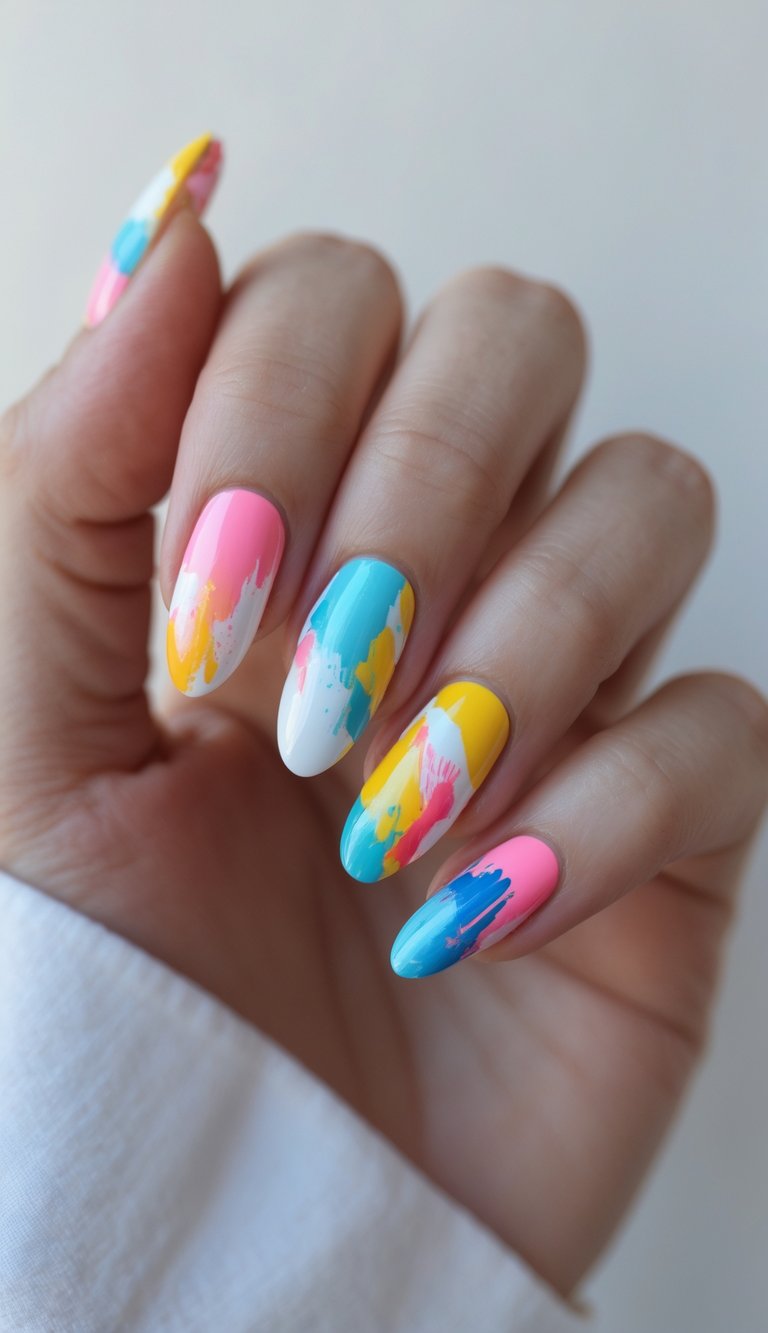 Skittle nail art idea with colorful abstract brushstroke design in pink, yellow, white, and blue on almond-shaped nails