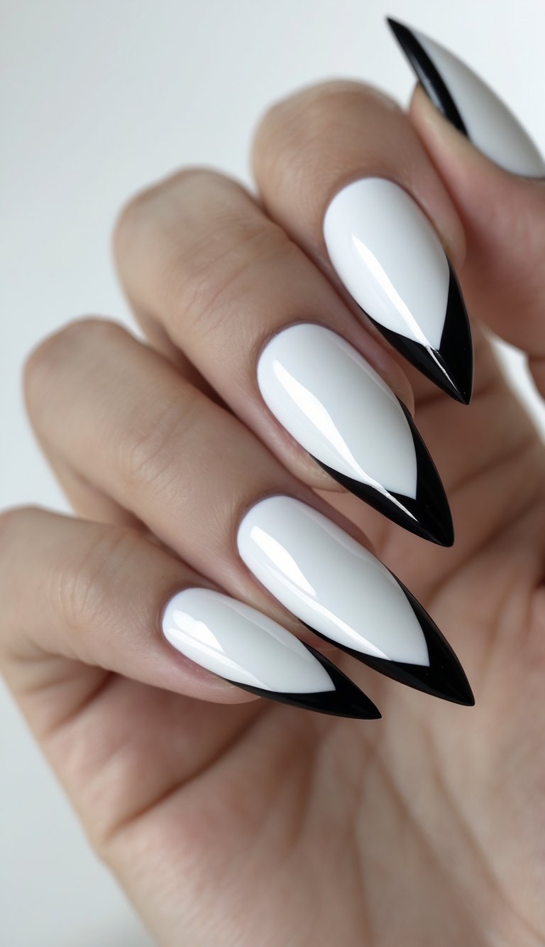 Stiletto nail art idea featuring high-gloss white nails with sleek black tips for a tuxedo-inspired look