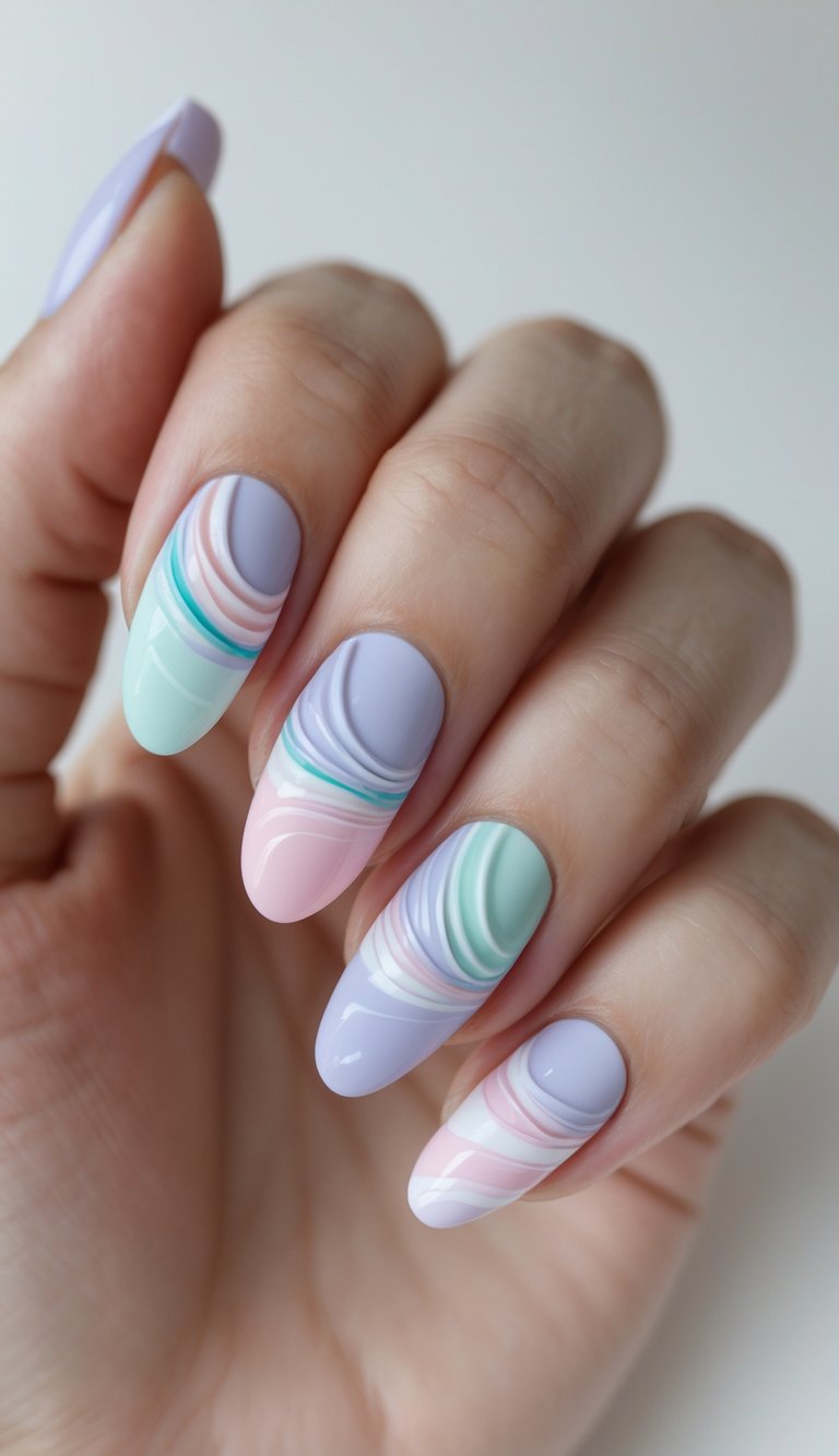A hand with round nails featuring marbled wave-like swirls in pastel lavender, mint green, baby pink, and white, resembling abstract watercolor movement.