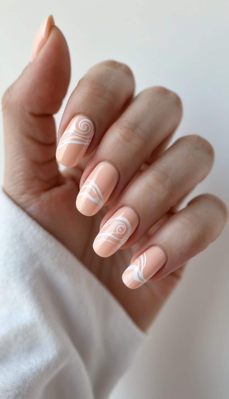 Close-up of hands with soft peach nails and flowing white swirl accents, offering a serene twist on march nail art ideas.