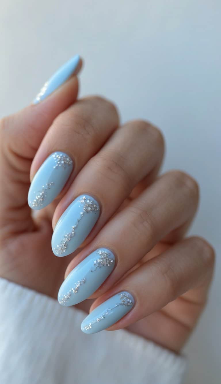 Close-up of hands with soft blue nails featuring delicate vertical floral embellishments, showcasing a refined style for march nail art ideas.