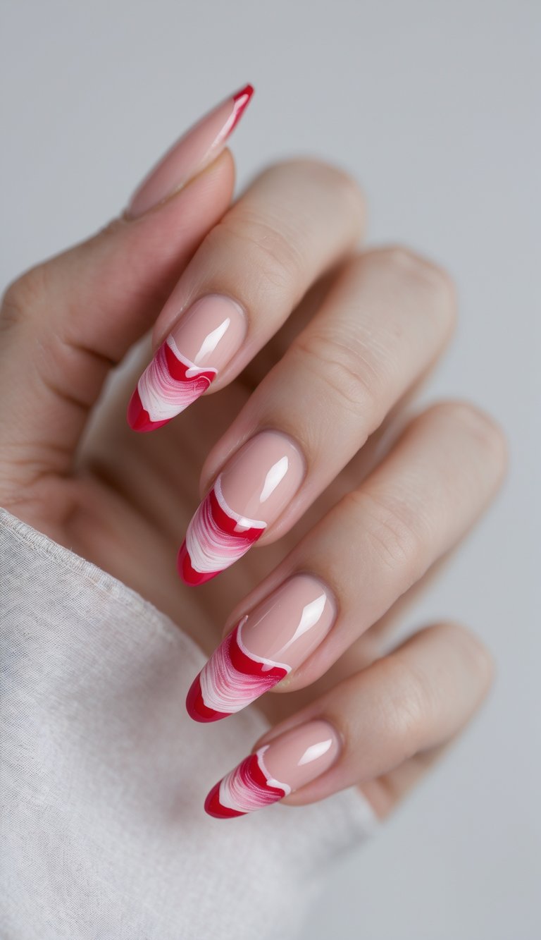 Angled fingers display nude almond nails accented by bright red tips and delicate white curved lines, highlighting a contemporary dainty nail art idea.