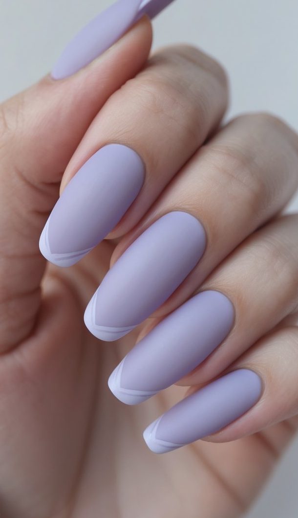 Close detail of lavender matte nails with fine white French edging, smooth texture, gentle contrast, and a contemporary colored French nail art idea look.