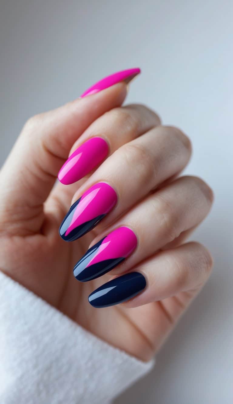 Shown on a softly posed hand, bright pink nails fade into dark navy sections, highlighting sharp, glossy two tone nail art ideas with a clean almond silhouette.