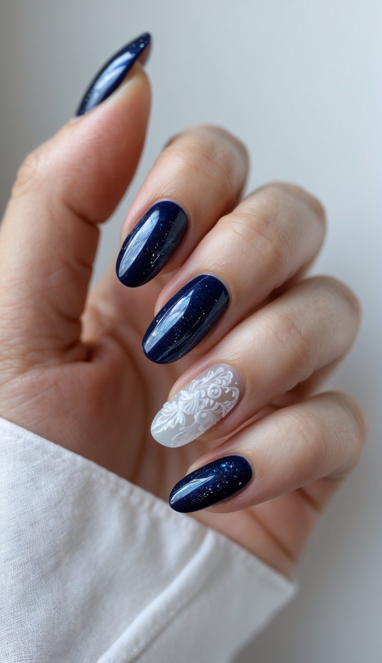 Close-up of a feminine hand wearing a midnight blue nail art idea, blending sparkly navy polish and a single matte white floral-accented nail.