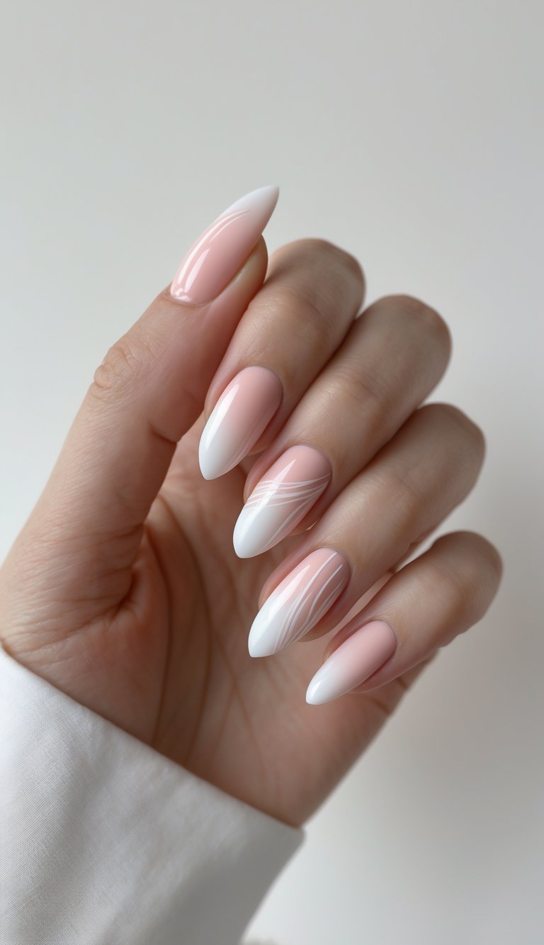 Close-up of a hand featuring an ombre French nail art idea where pink polish fades into white, with thin white swirl accents on two nails.