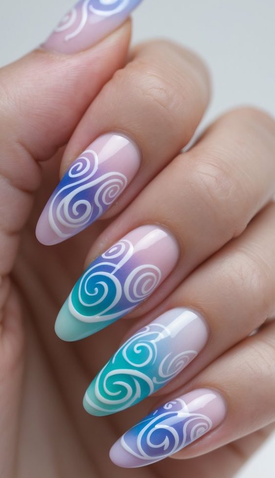 Swirl nail art idea on a hand, showcasing soft pastel gradients from pink to teal with whimsical white spirals across glossy almond-shaped nails.