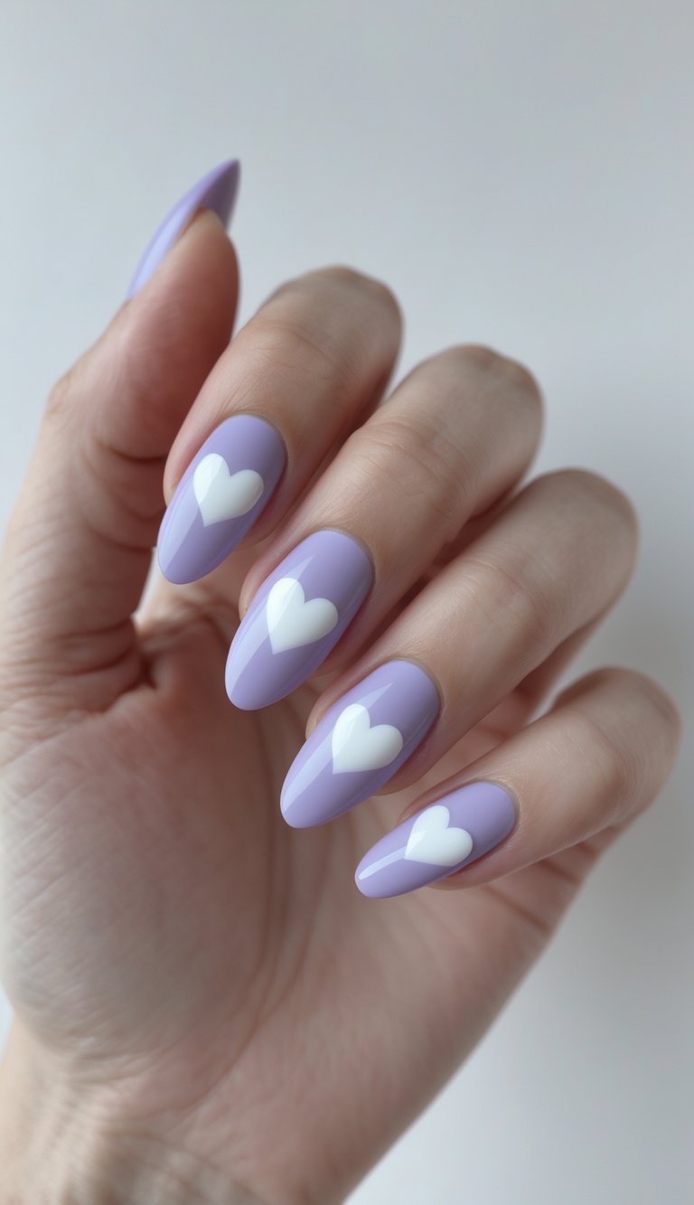 Hand with almond-shaped nails painted pastel lavender, each nail featuring a large white heart centered neatly—perfect for a soft heart nail art idea.
