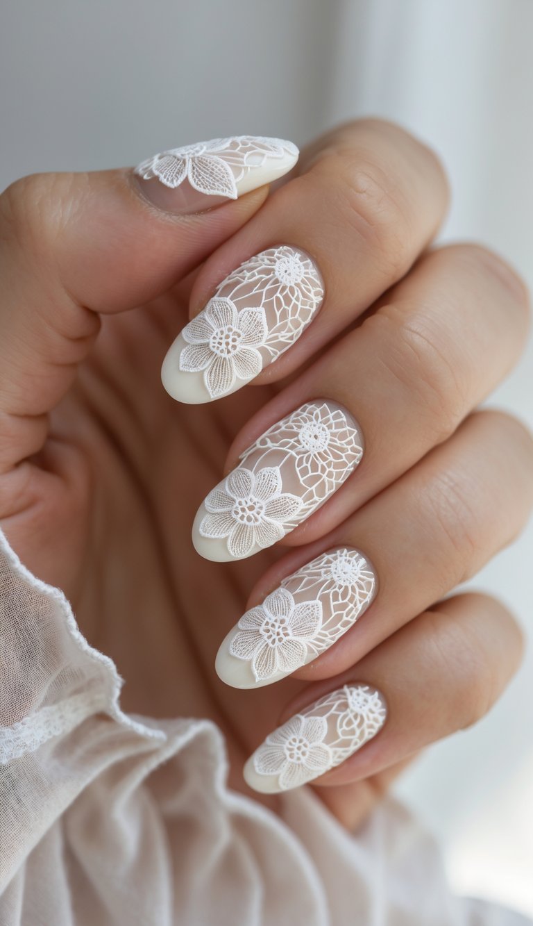 Hand with long almond nails featuring sheer nude polish, milky white tips, and embossed lace floral patterns—elegant and dreamy lace nail art idea.