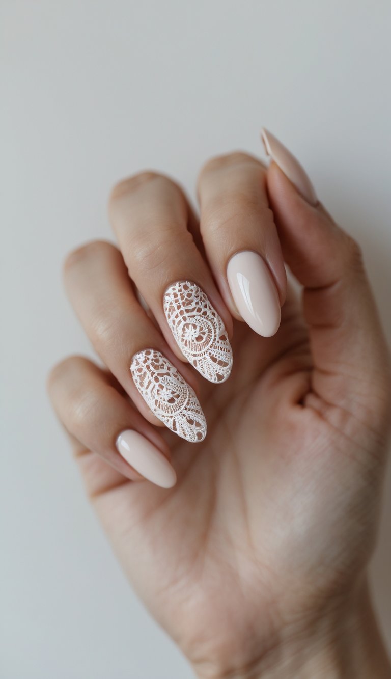 Close-up of a lace nail art idea featuring nude almond nails and two intricately laced accent nails that mimic the look of bridal lacework.