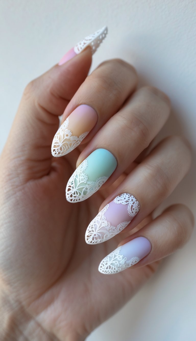 Almond nails with a matte pastel ombré finish from peach to lilac, topped with white lace art, showcasing a colorful lace nail art idea.