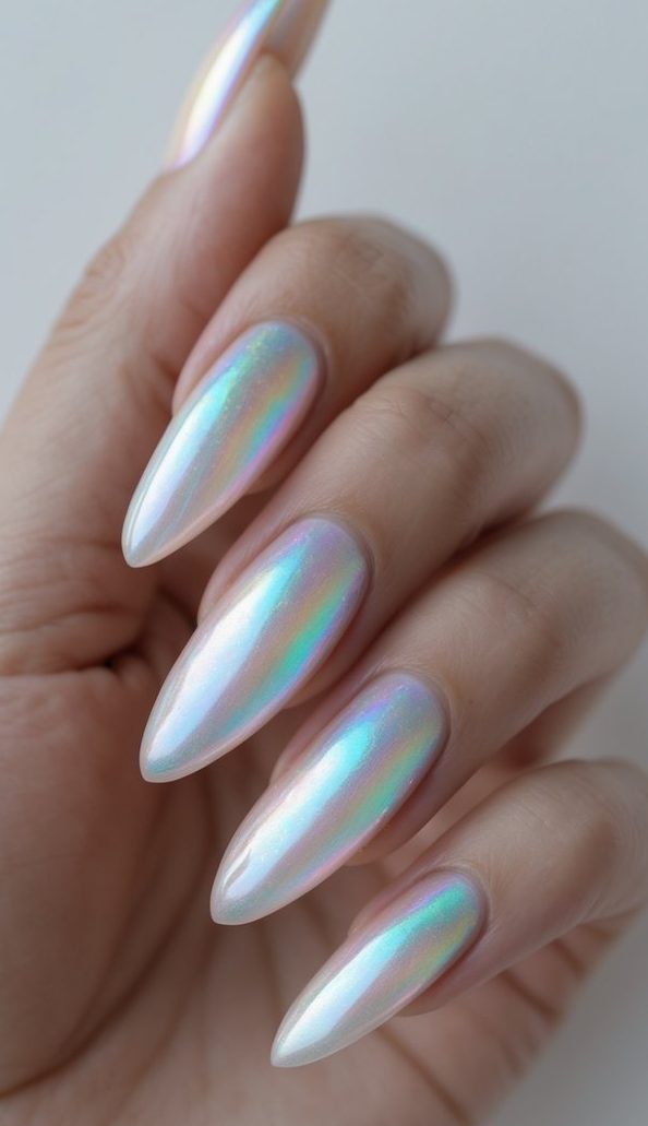 Iridescent white nails with soft pastel shifts in blue, lilac, and peach tones—showcasing a glowing long nail art idea.