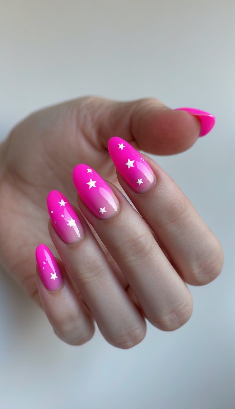 Close-up of a Barbiecore nail art idea showing neon pink nails with a nude base and white star decals, styled on almond-shaped tips.