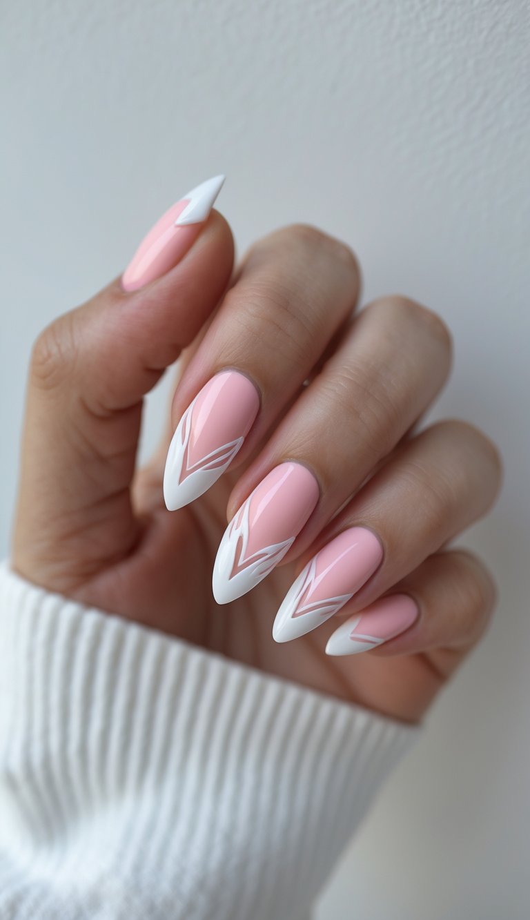 Barbiecore nail art idea with soft pink almond nails accented by angular layered white chevron French tips, held against a white ribbed sweater.