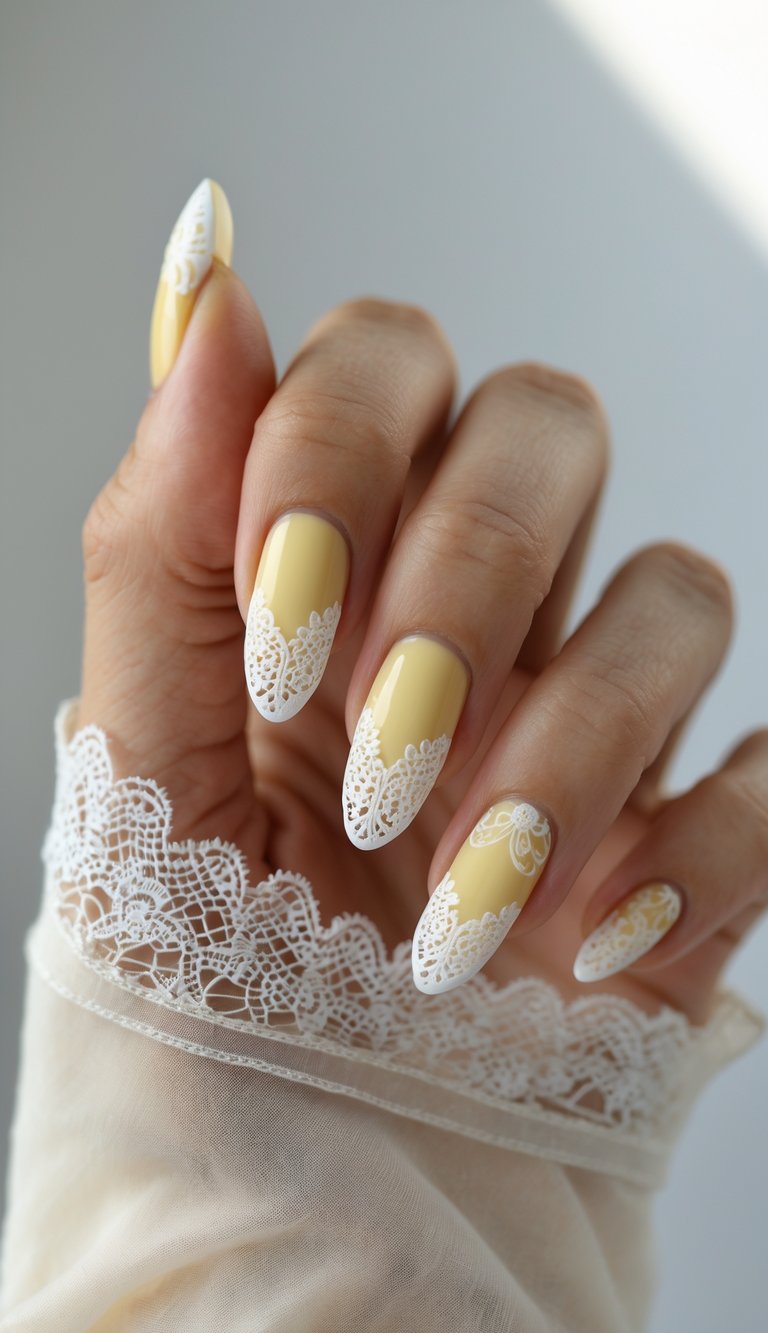 Glossy almond nails painted in warm yellow with fine white lace accents, showcasing a soft and elegant coquette nail art idea.