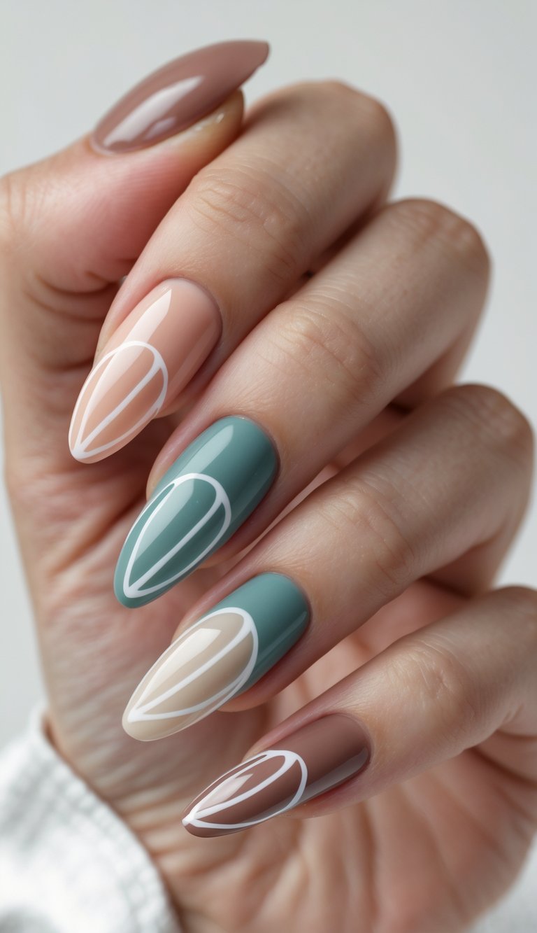 Close-up of mix and match nail art idea showing alternating soft green, tan, and dusty pink nails with clean white abstract petal outlines on a sleek hand.