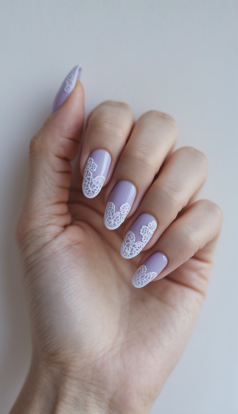 A manicured hand displays a purple and white nail art idea with lavender polish layered beneath delicate white lace-inspired nail art details.