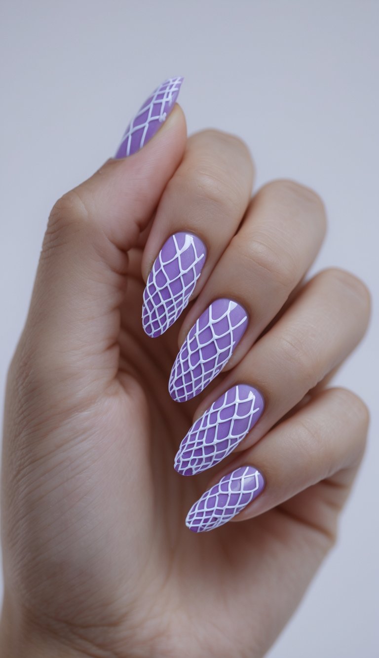 Fingers shown against a neutral background feature lilac nails with white lattice detailing, highlighting a contemporary purple nail art idea inspired by clean geometry.