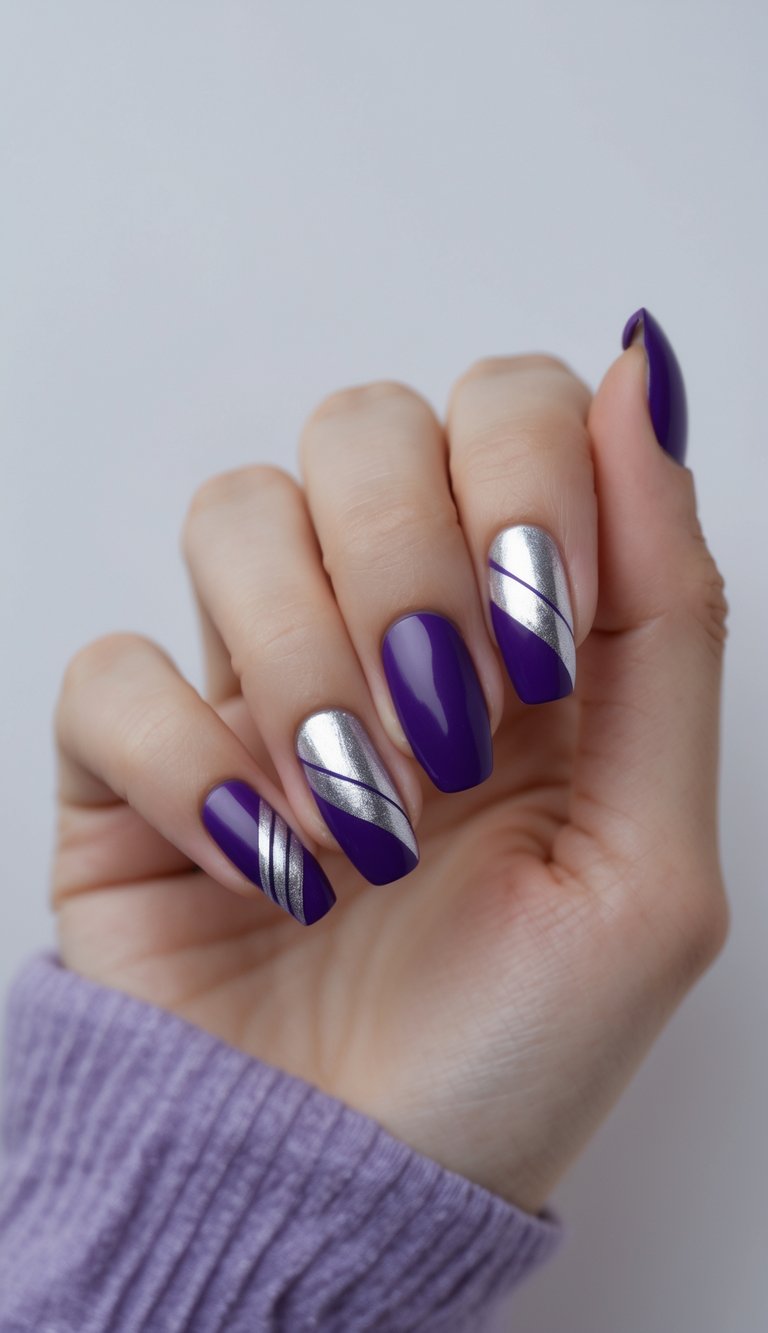 Close-up of one hand with deep violet nails decorated with metallic silver stripes against a white background.