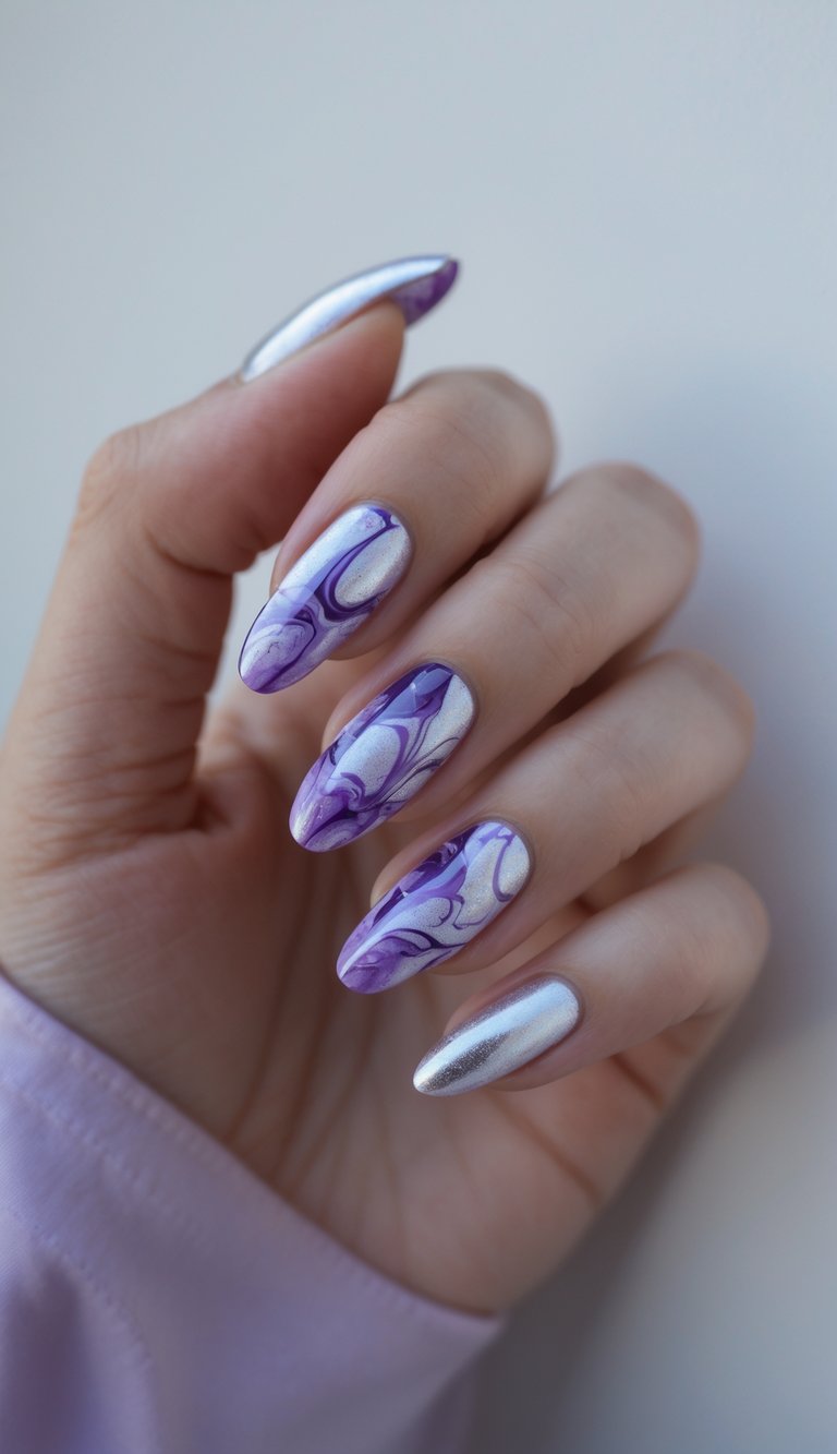 Close-up of a hand with silver and purple marble effect nails against a white background.