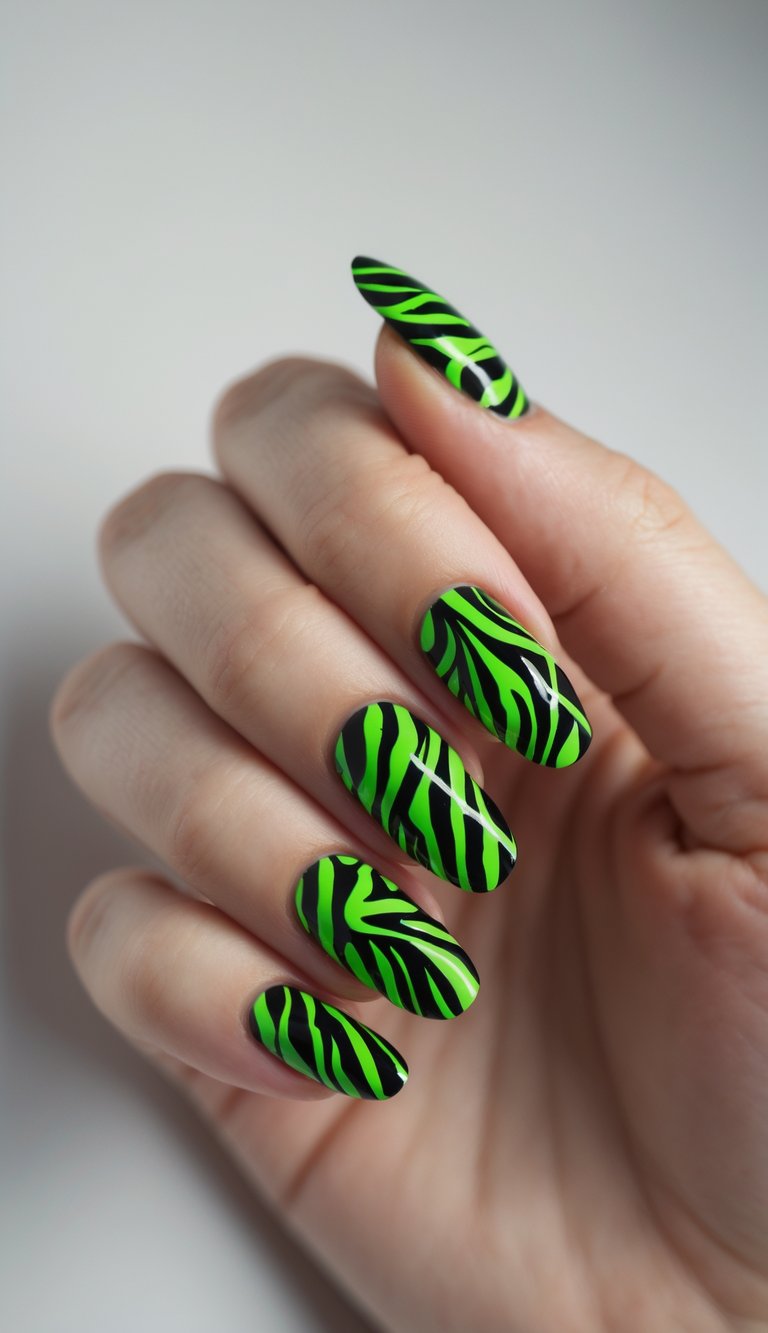 Close-up of one hand with neon green zebra print nail art on black nails against a white background.