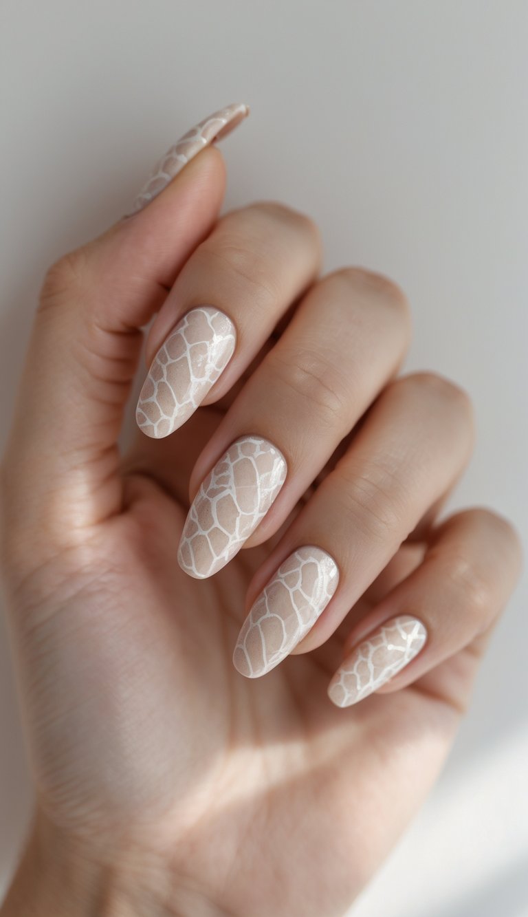 Close-up of a single hand with beige snake print nail art on a white background.