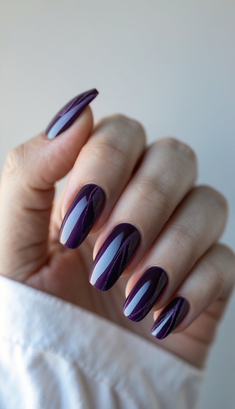 Close-up of one hand with deep purple glossy nails showing detailed nail art on a white background.