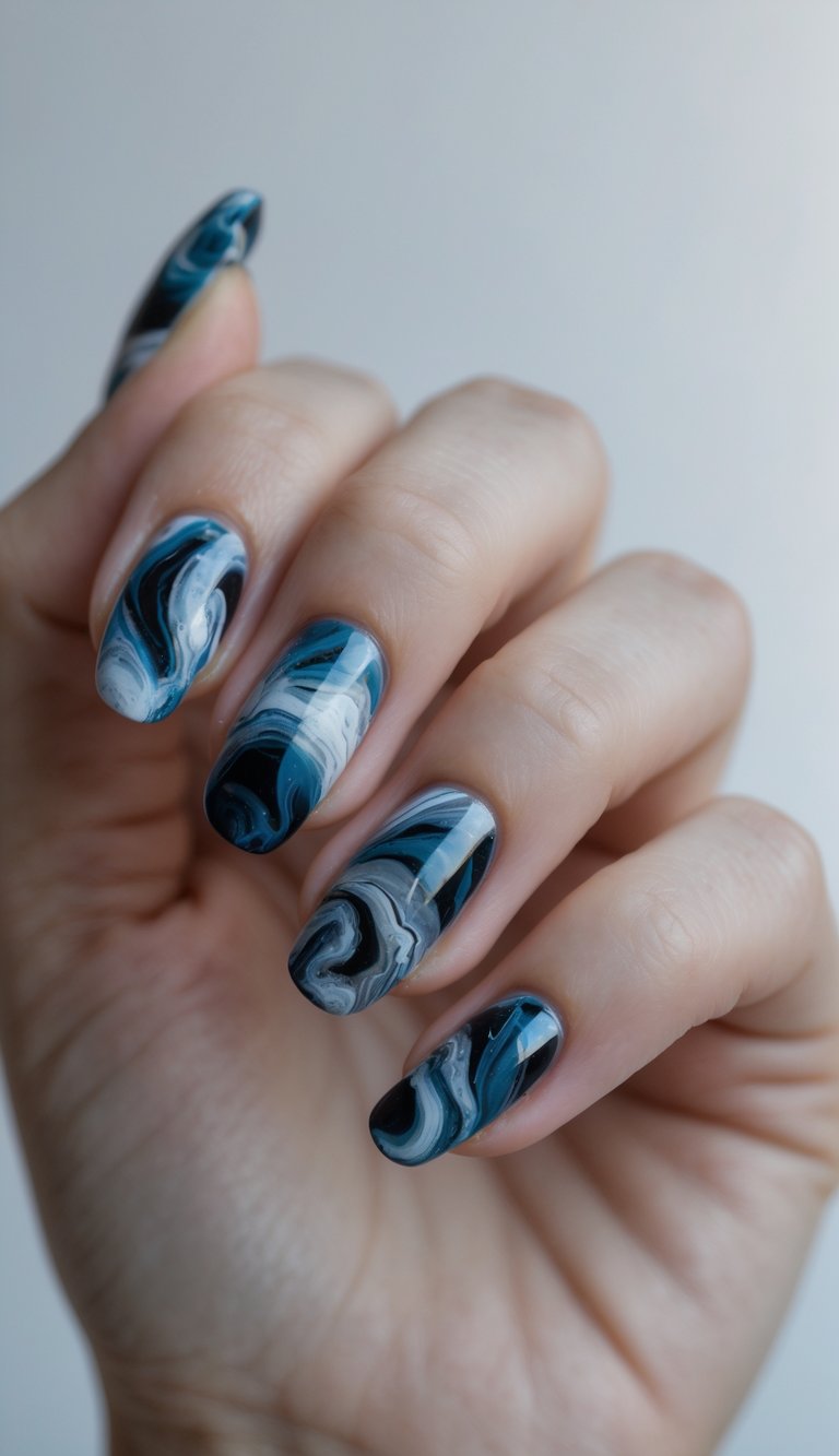 Close-up of one hand with marbled nail art against a white background.
