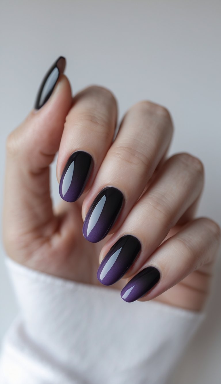 Close-up of one hand with black nails featuring a dark purple gradient on a white background.