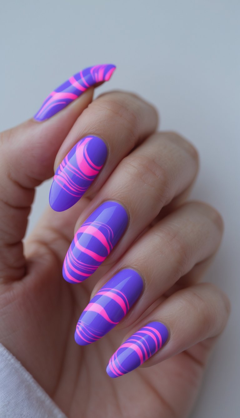 Close-up of one hand with neon purple nails decorated with neon pink swirl patterns on a white background.