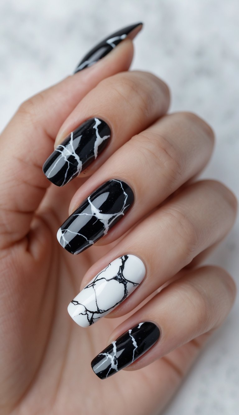 Close-up of one hand showing nails with black and white marble design against a white background.