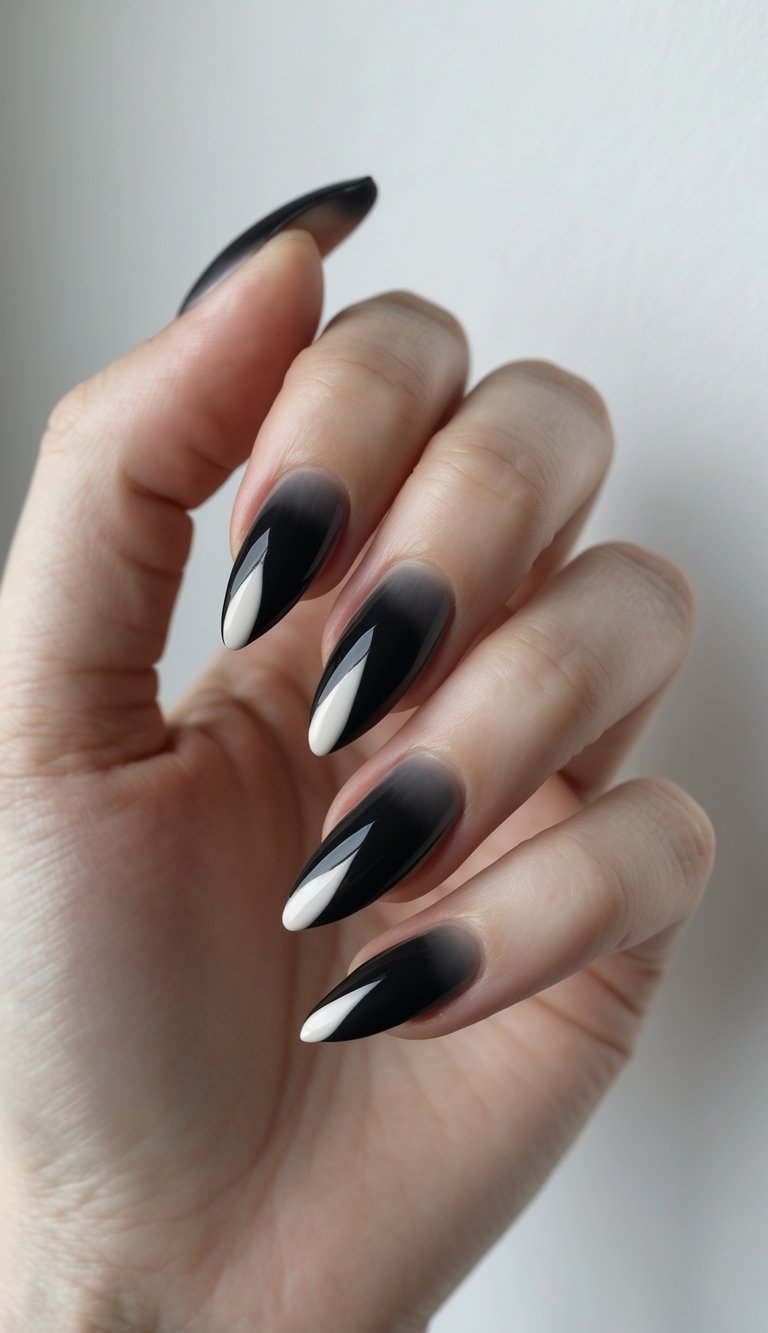 Close-up of one hand with charcoal black nails featuring matte tips against a white background.
