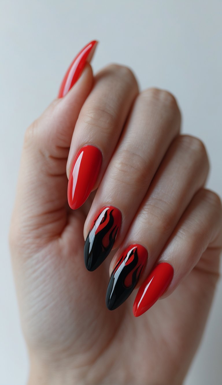 Close-up of one hand showing glossy red nails with black flame designs on a white background.