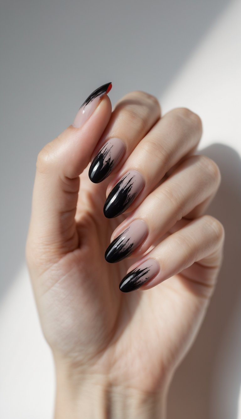 Close-up of a single hand with black nails featuring smudged red tips against a white background.