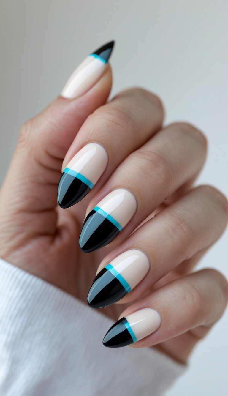 Close-up of one hand with almond-shaped nails featuring color block nail art against a white background.