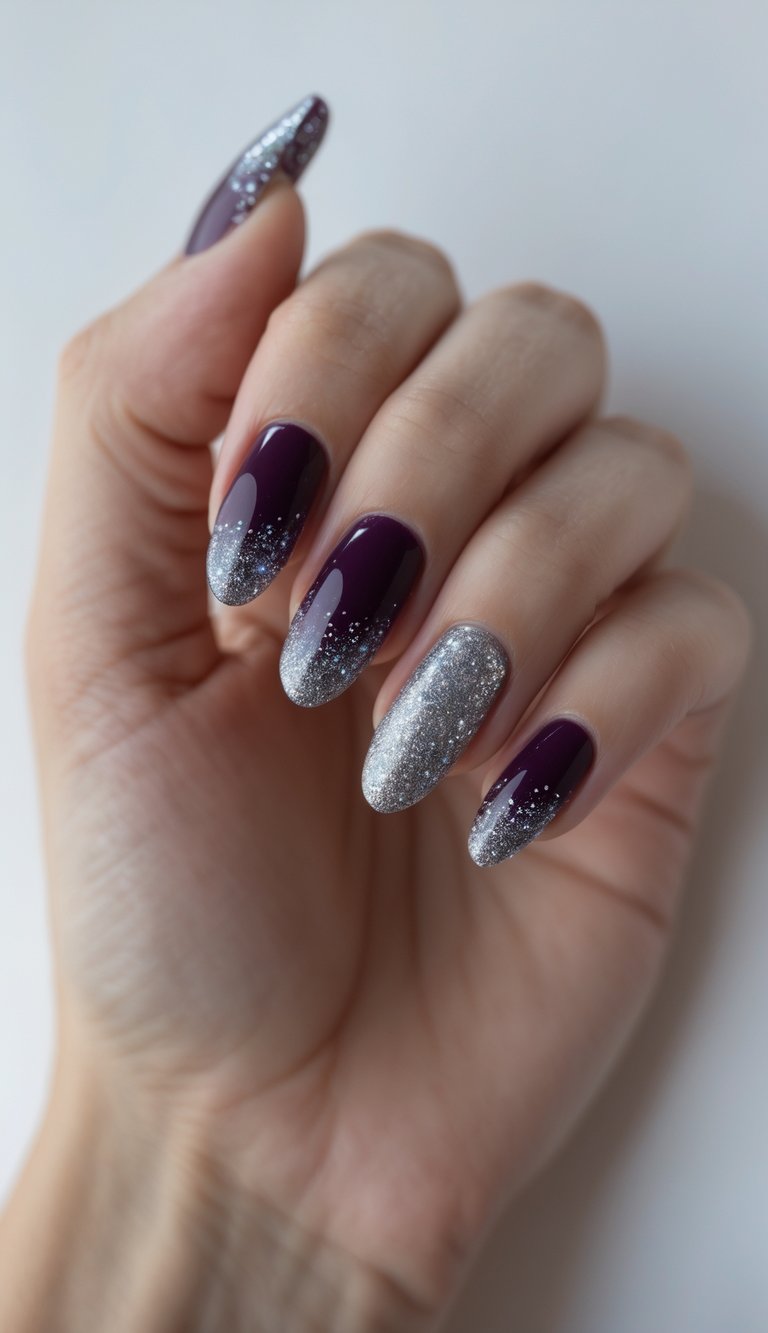 Close-up of one hand with deep purple nails and silver glitter tips against a white background.